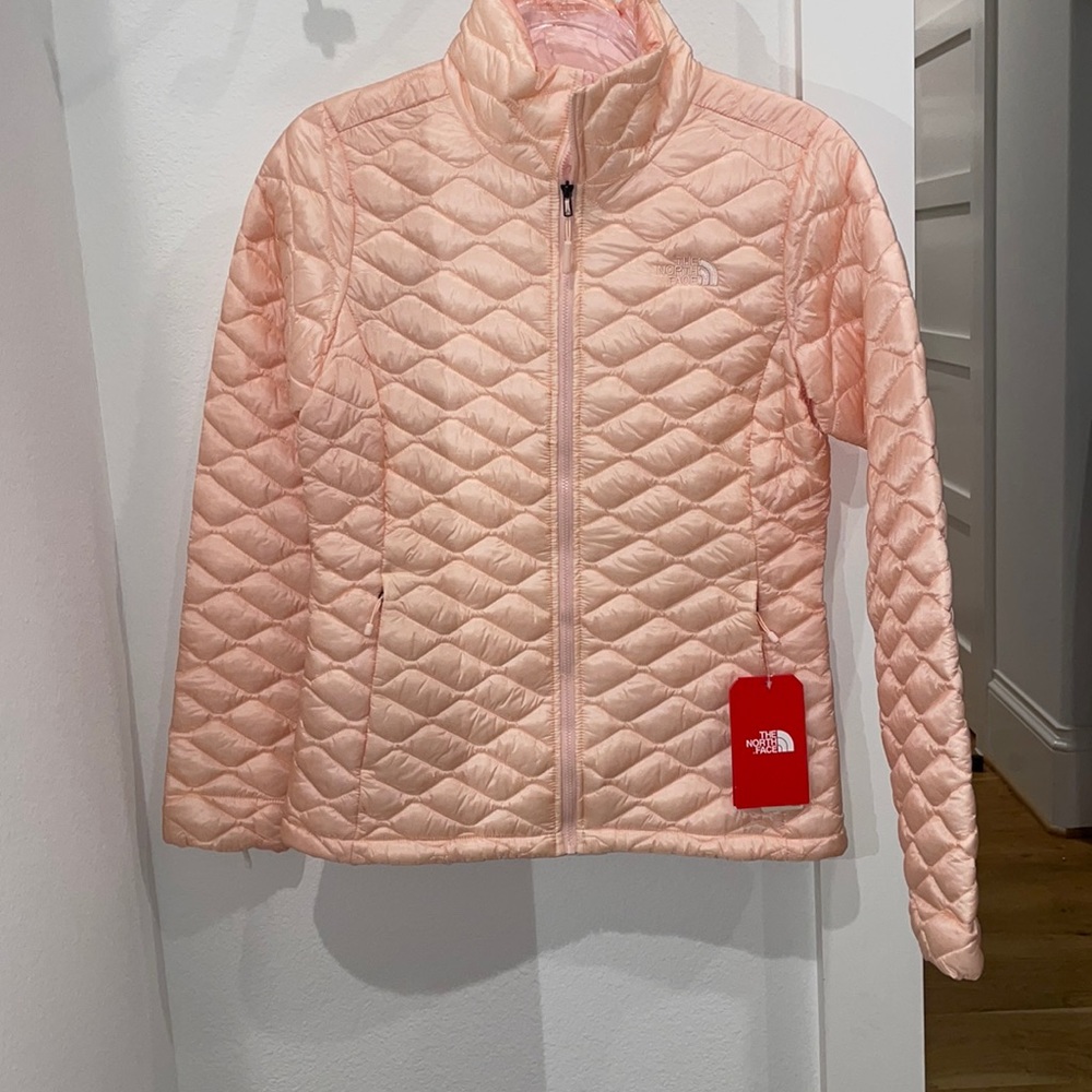 Brand new Women’s North Face size S Thermoball light peach color jacket .